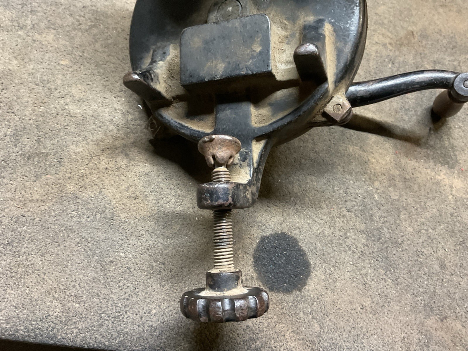 Hand crank bench grinder clamps to workbench