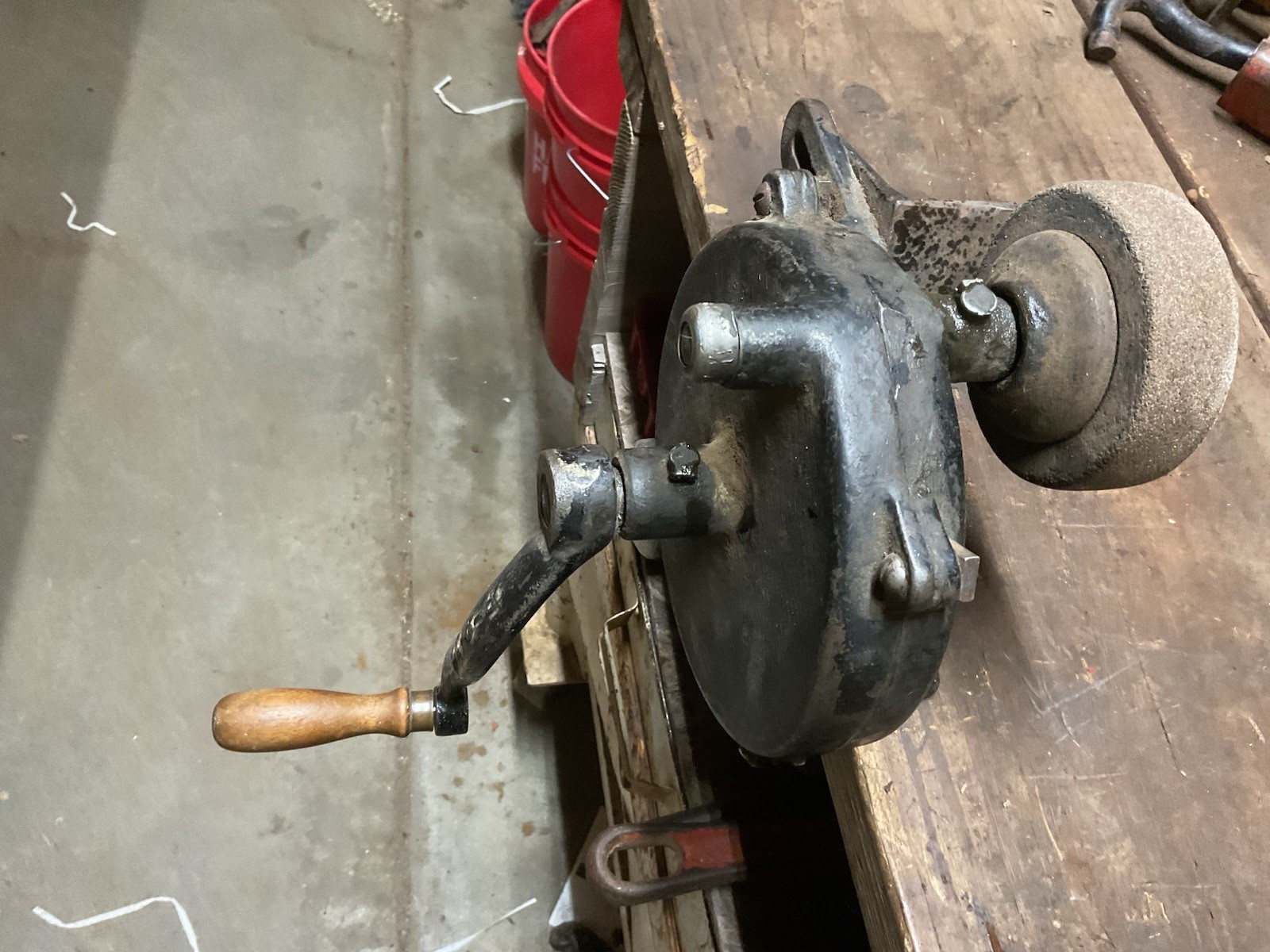 Hand crank bench grinder clamps to workbench