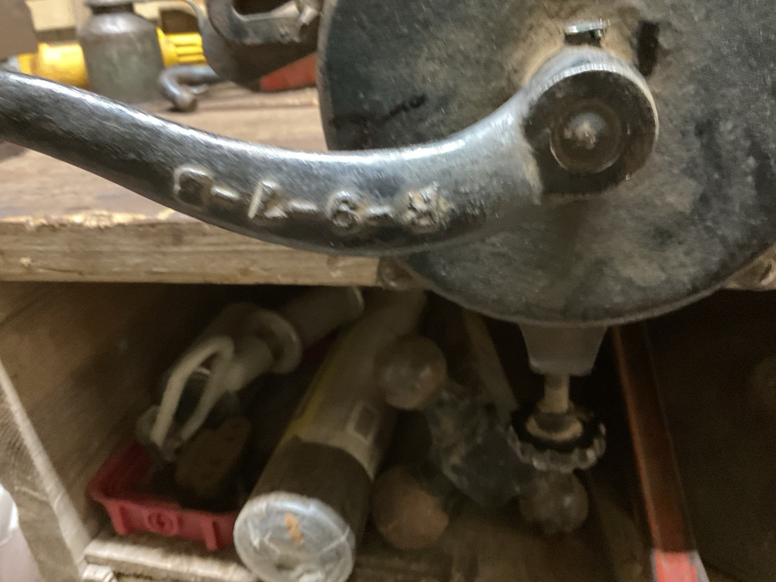 Hand crank bench grinder clamps to workbench