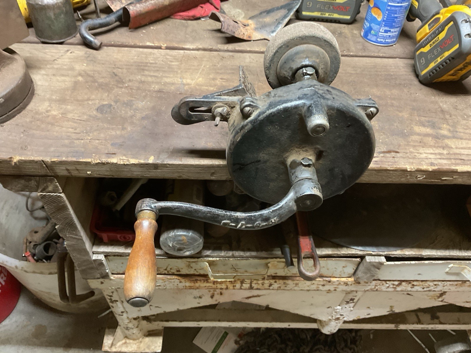 Hand crank bench grinder clamps to workbench