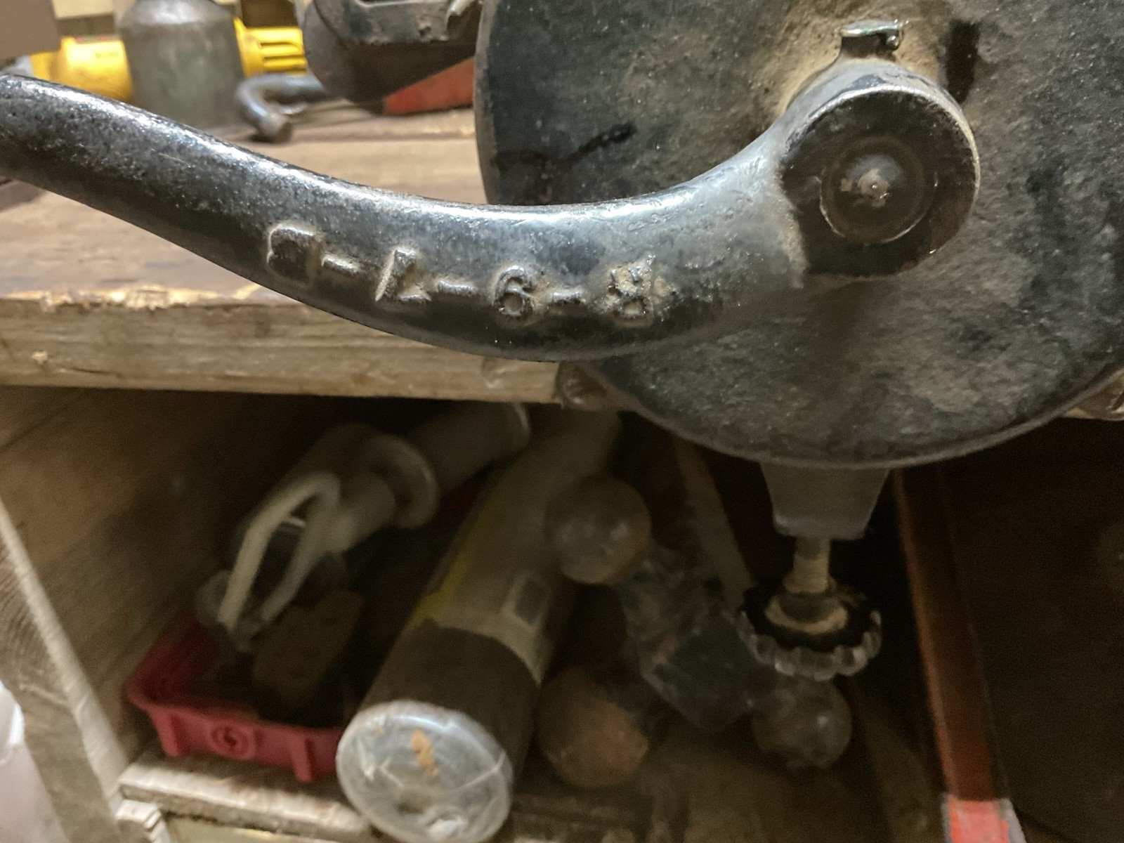 Hand crank bench grinder clamps to workbench