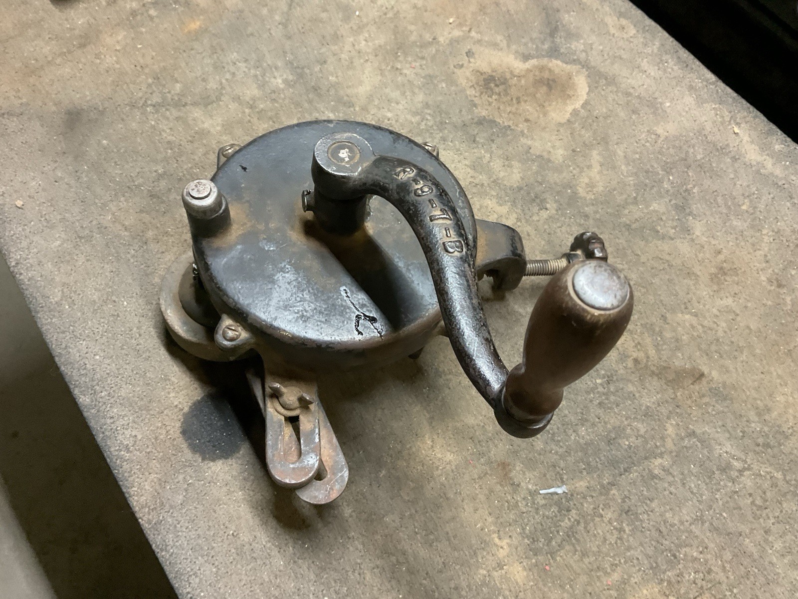Hand crank bench grinder clamps to workbench