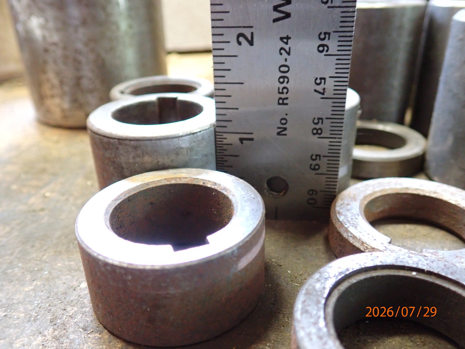 LOT 62: PILE OF HORIZONTAL MILLING MILL MACHINE SPINDLE SPACERS 1″ & 1-1/4″ DIA