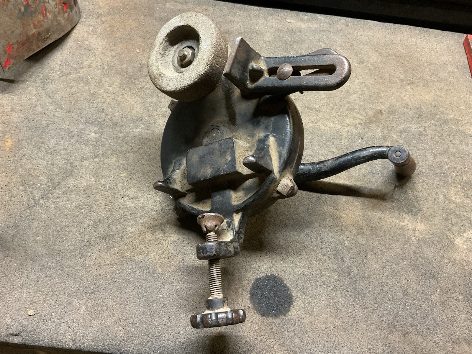 Hand crank bench grinder clamps to workbench