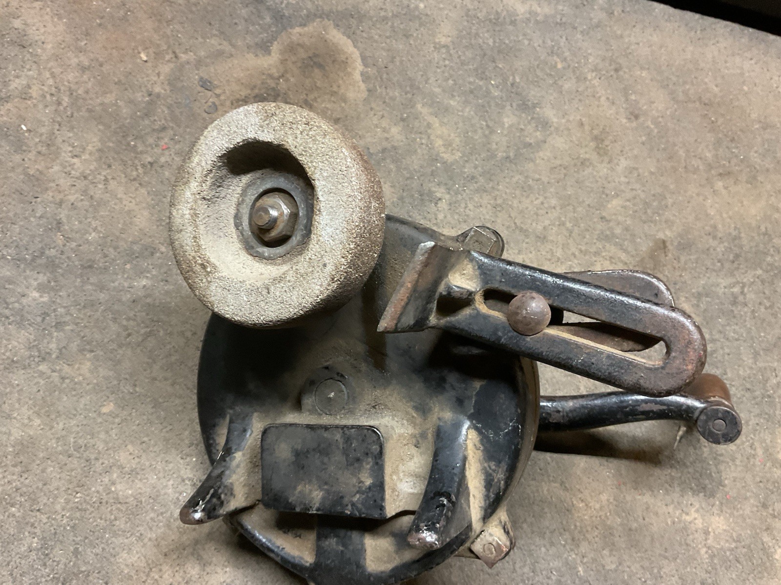 Hand crank bench grinder clamps to workbench